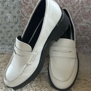 White penny loafers size 8M Never worn gunmetal embellishment on heel.